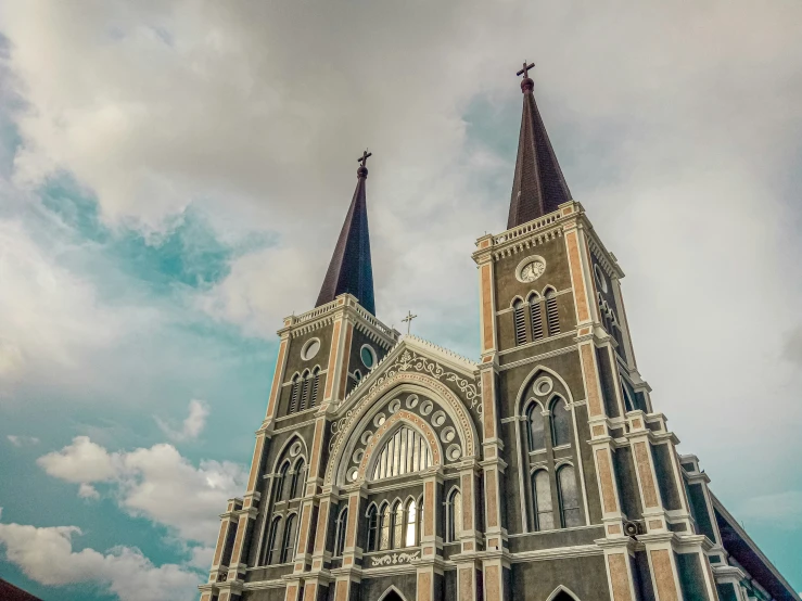 a church steeple with two clocks on it