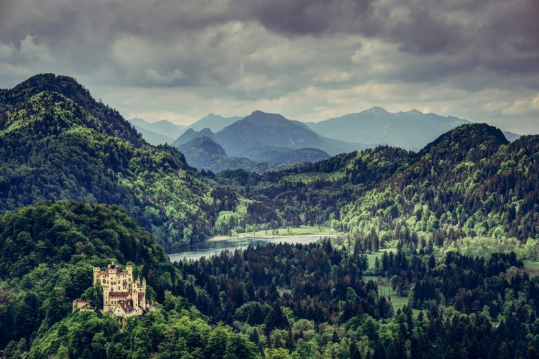 a castle perched on the side of a large hill