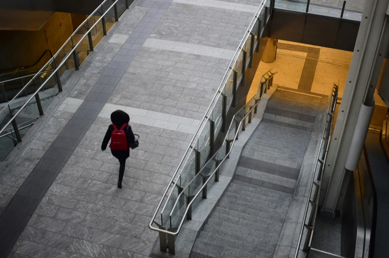 a person is walking up some stairs on top of a building