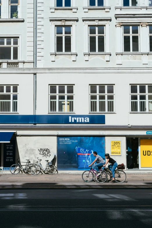 an image of the city street with bike riders