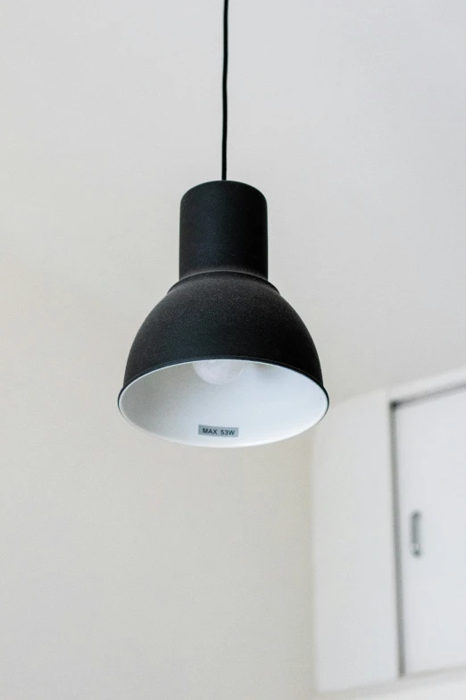 an overhead light hanging from the ceiling of a room