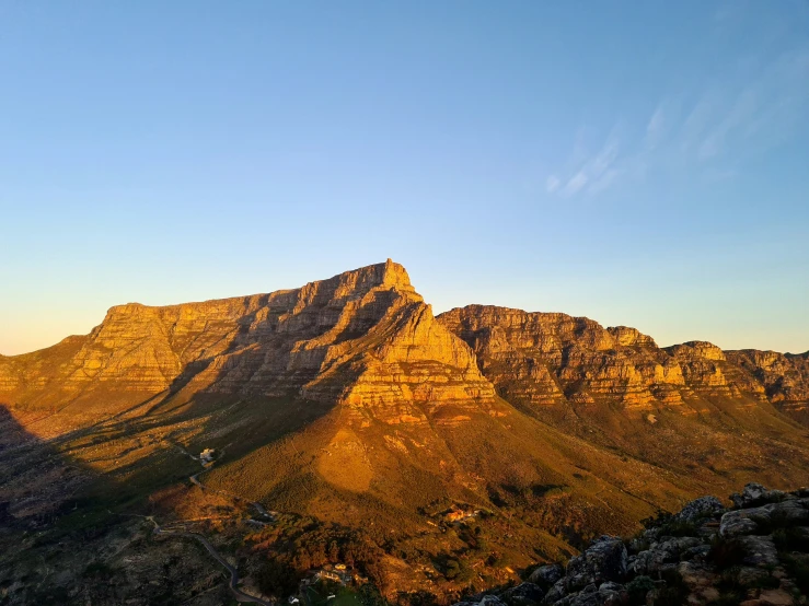 two large mountains are seen in the distance