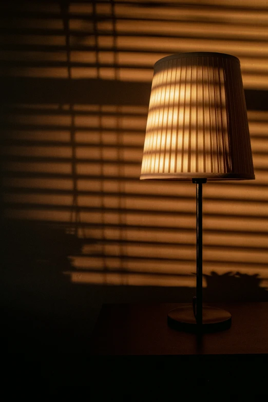 the lamp shade is shining brightly on a table