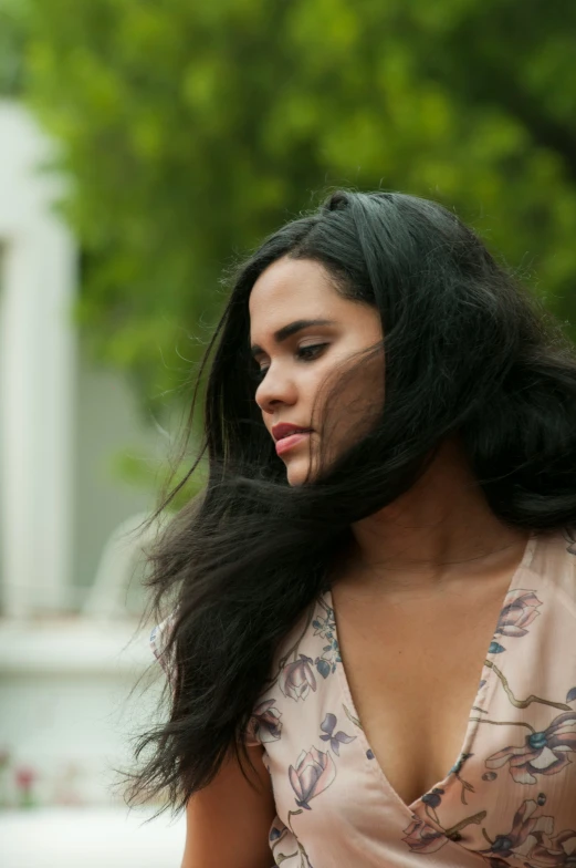 a woman is wearing sheer hair while on her cell phone