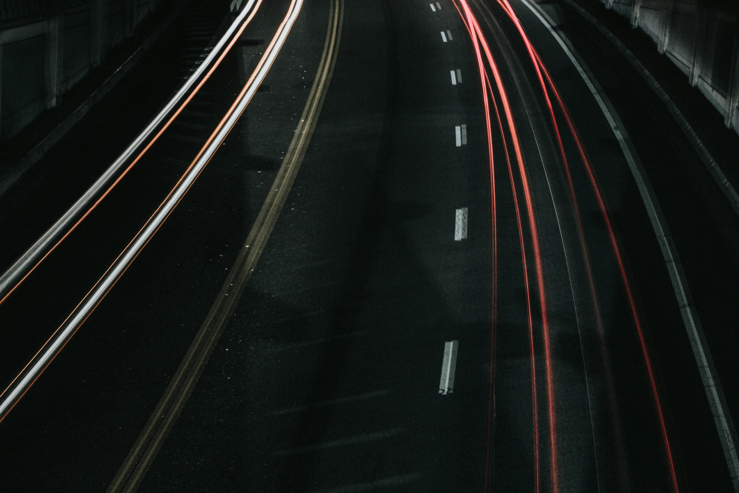 a blurry po shows a highway with traffic lights