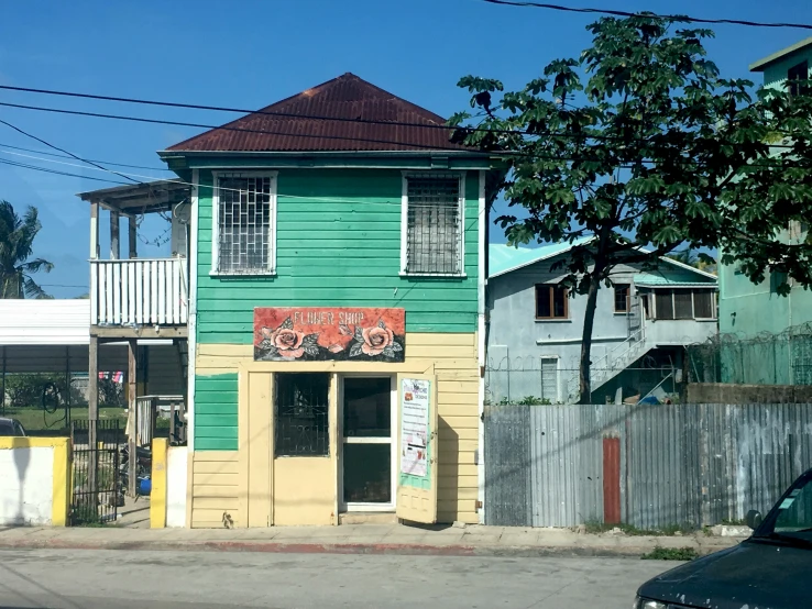 a couple of large buildings with colorful shutters on the front of them