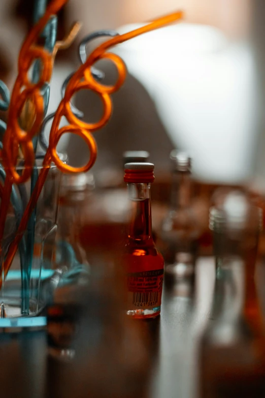 a table with various bottles and utensils on it