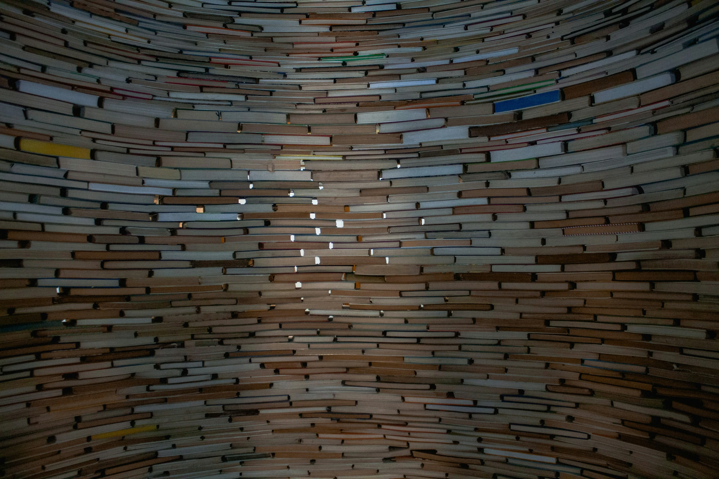 a wall made of bricks that has light shining through