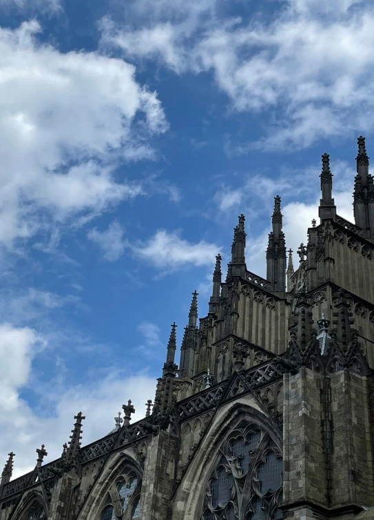 the sky over a large cathedral with many spires