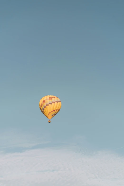 a  air balloon floats high into the sky