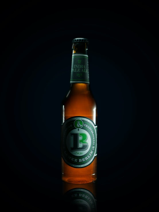 beer bottle on table in black background