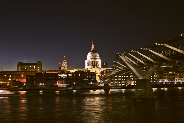 a very big bridge by some pretty lights in the dark