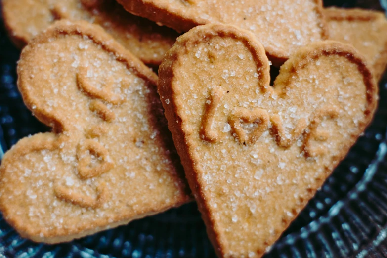 hearts shaped cookies sitting on a plate