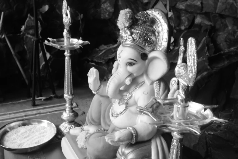 a statue of the god ganesh on a plate