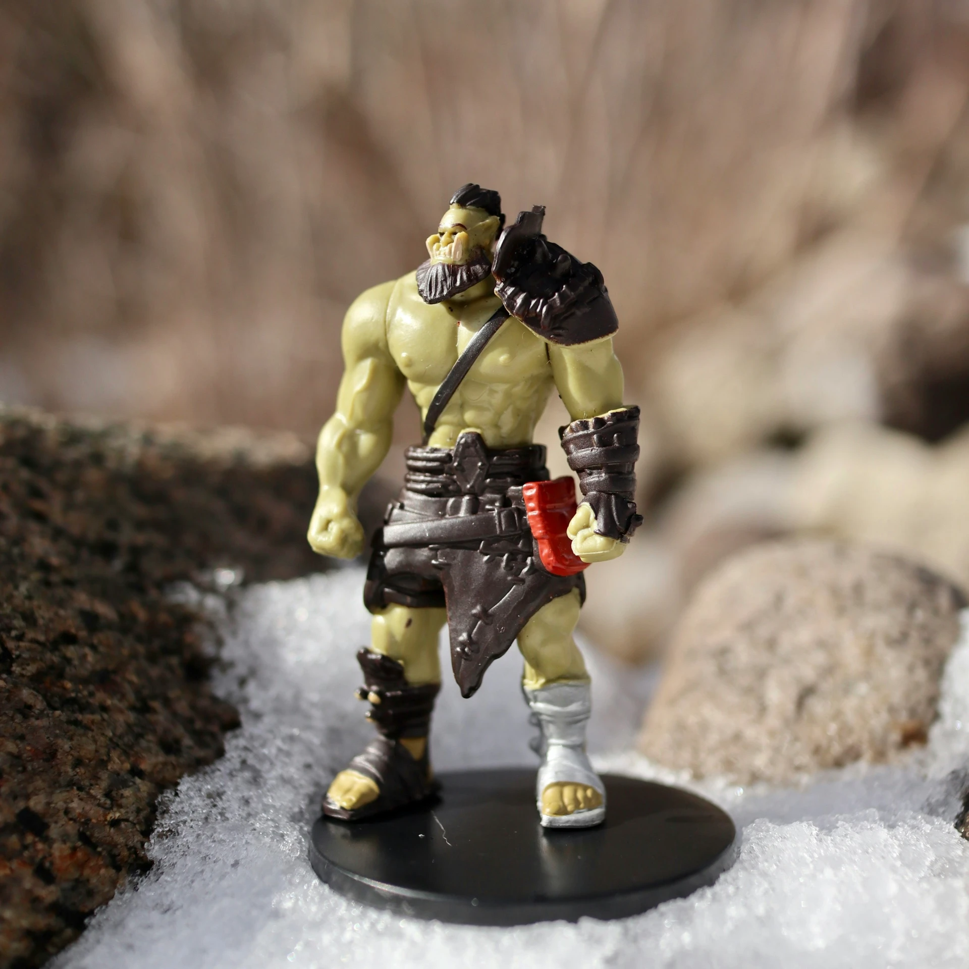 a small action figure of a man with a sword