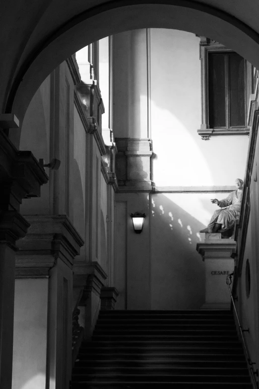 the top of a staircase is illuminated by the sunlight coming through a window