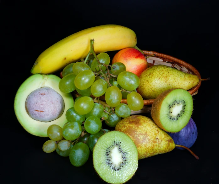 fruits in a basket sitting on the table