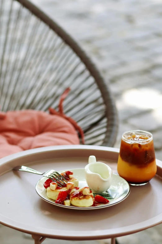 a plate that has food on it near a cup