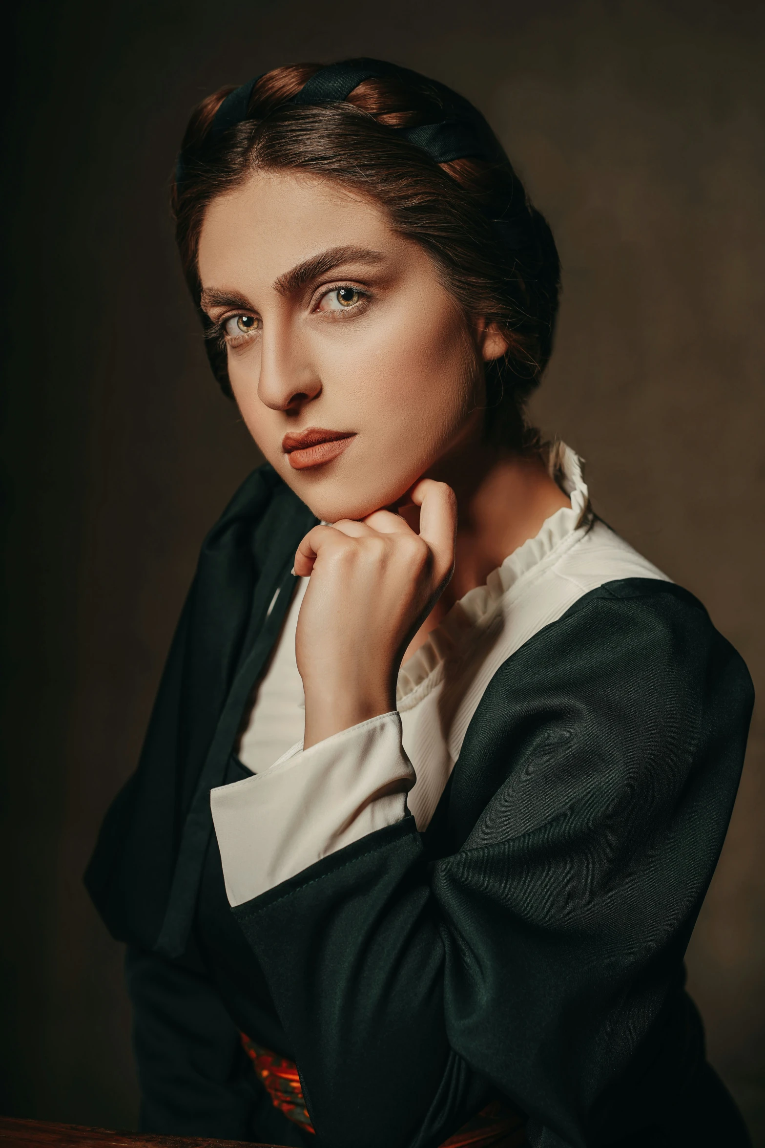 an old - fashioned po of a woman with short hair and a black suit