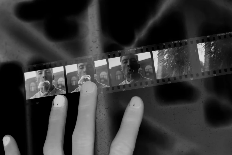 the po shows three different individuals taking the same pic as they are holding up two film strips