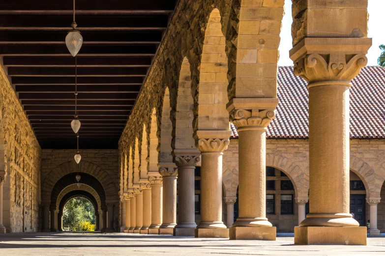 a building with many tall columns under a roof