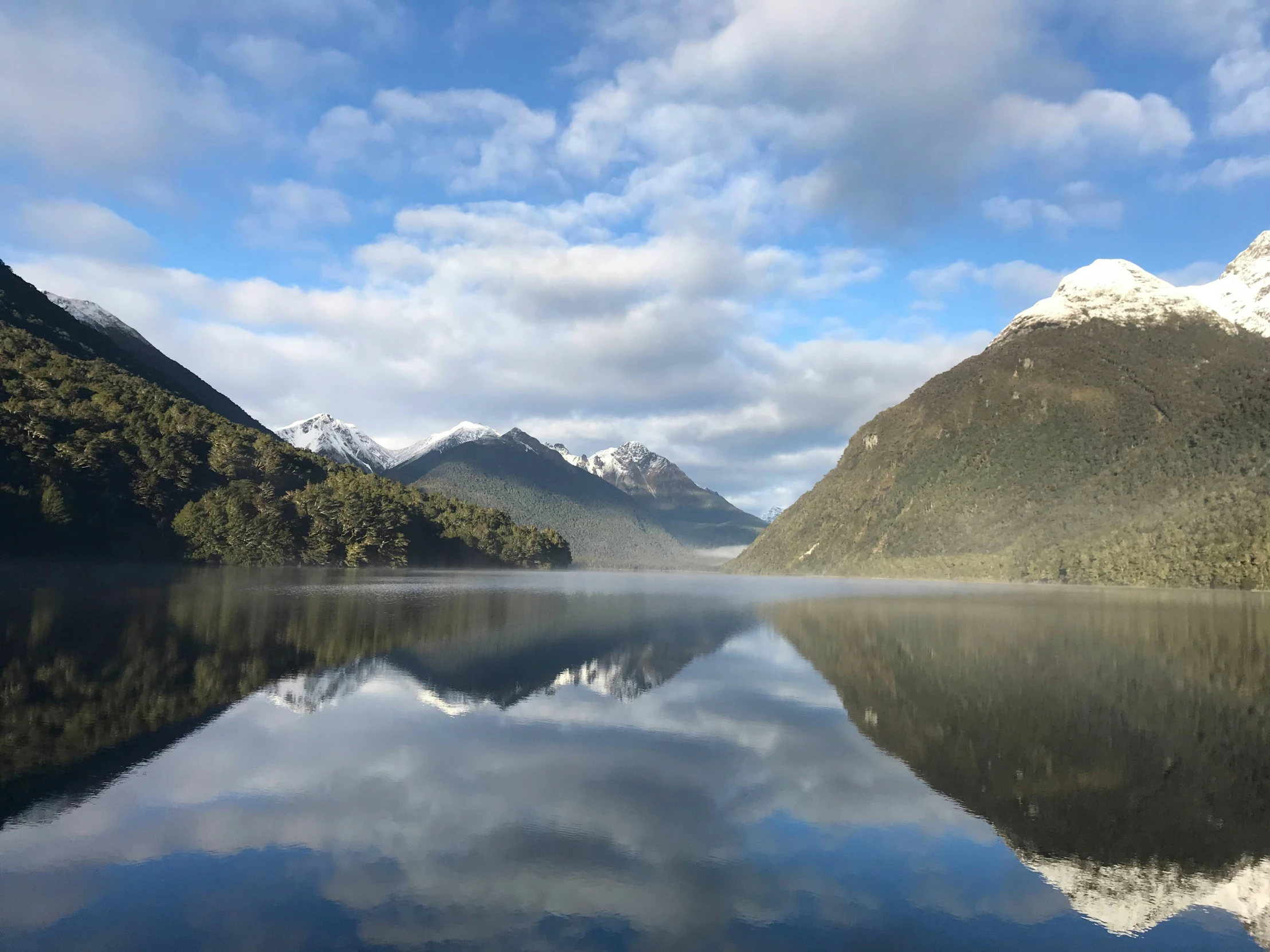 the mountains surrounding a body of water