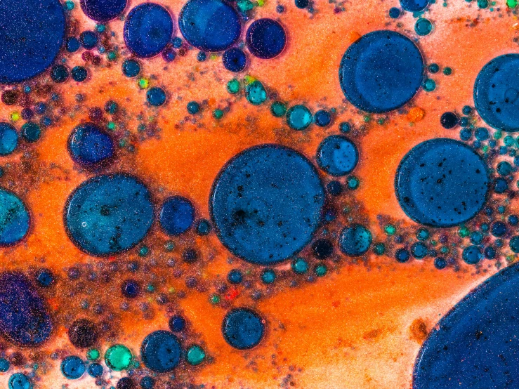 some liquid is mixed into an orange background