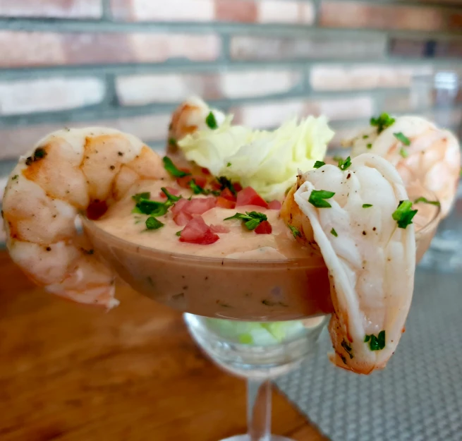 a close up of a drink glass with food