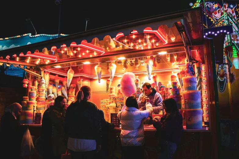 a small building with lots of brightly lite decorations on it