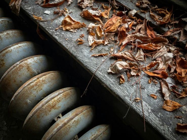 rusty iron pipes and caps on an old grungy surface