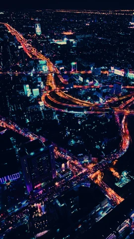 a city with many lit up freeways at night