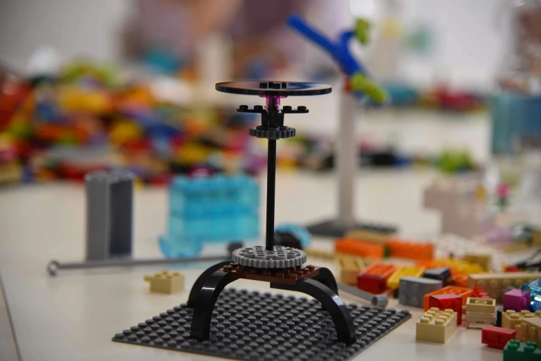 a lego table is arranged with colorful legos
