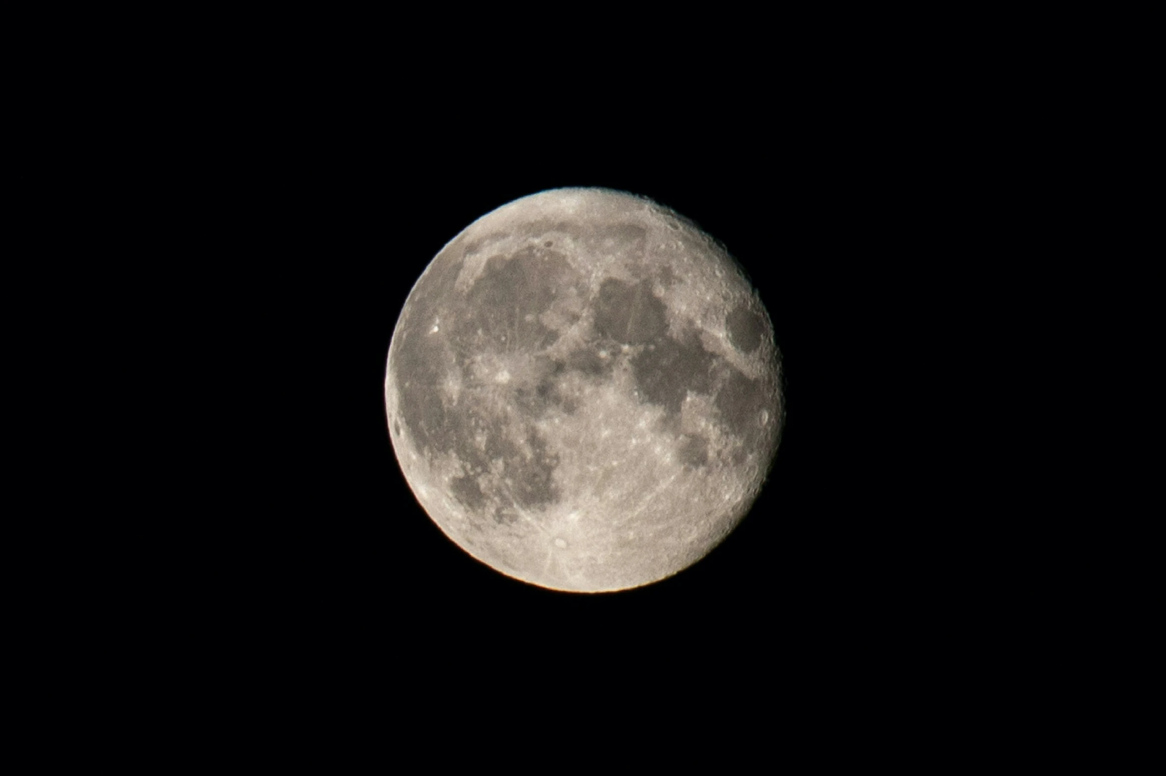 the full moon is seen from an airplane