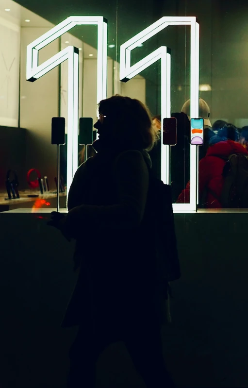 man in a dark room using his phone