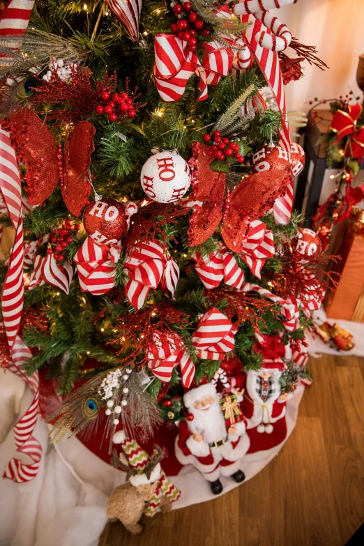 a decorated christmas tree next to a christmas tree