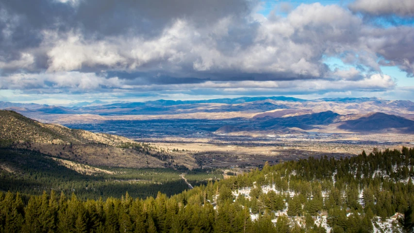 a landscape with some mountain ranges in the background