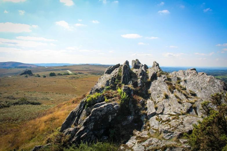 some very big rocks and a small patch of grass