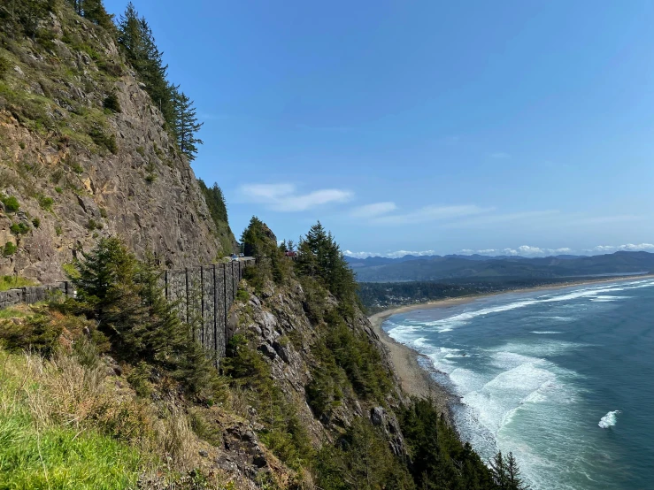 a scenic road on a steep cliff overlooking the ocean