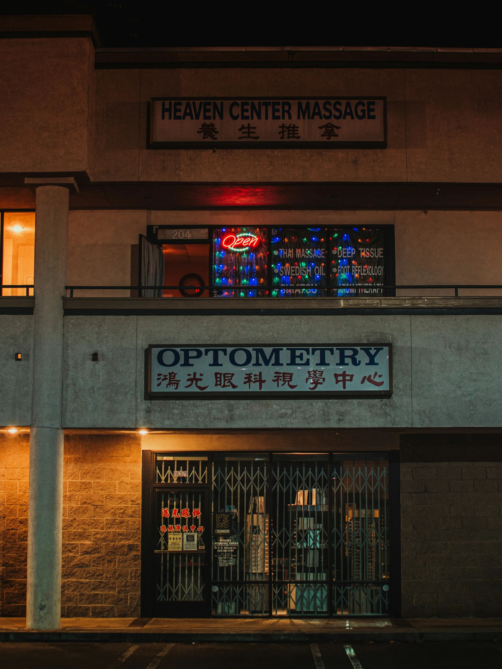 a sign above a doorway reads, heaven center massage