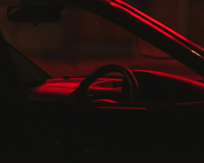 a red car interior showing the headlights