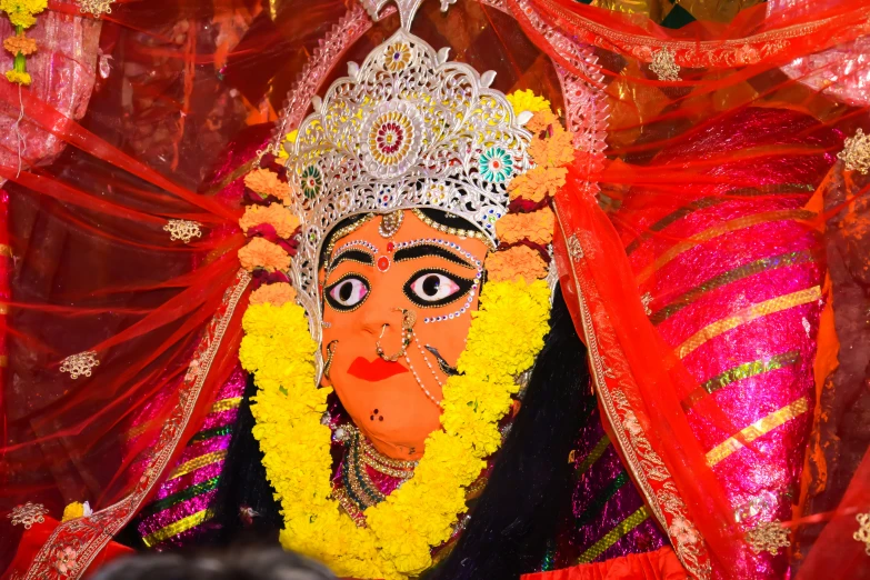 a colorful mask with many decorations and other decoration