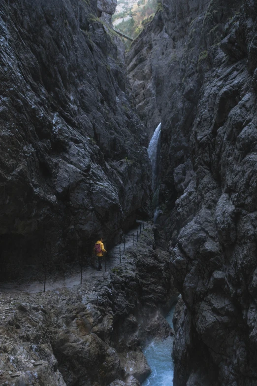 the stream runs between two rocks by itself