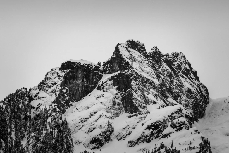 the top of a mountain covered in snow