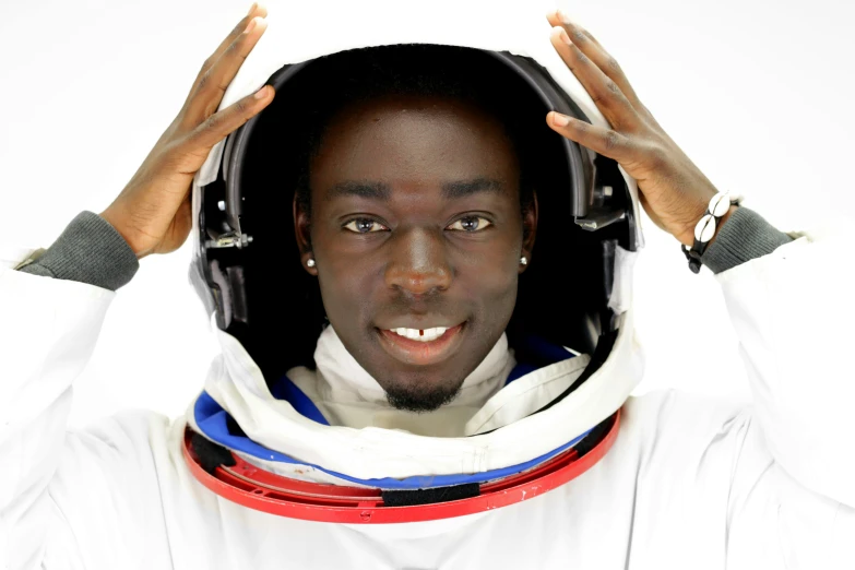 a man with headphones on holding his ears up and covering his eyes