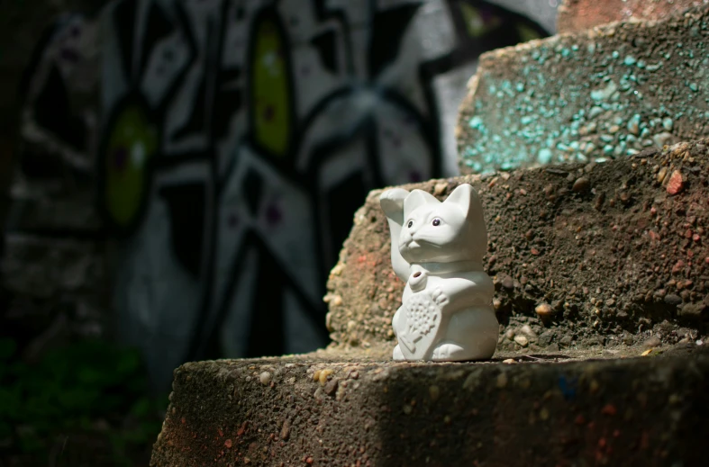 an owl statue sitting on top of some stairs