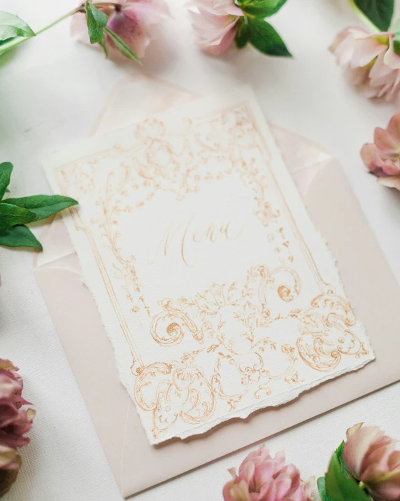 a close up of a wedding card with flowers
