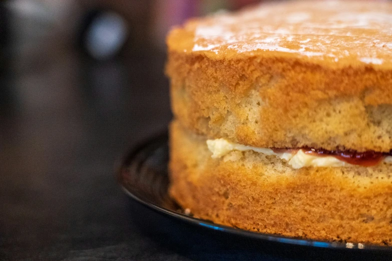 cake sitting on a plate with icing and icing