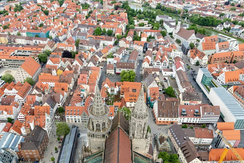 an aerial view of a town and a train track