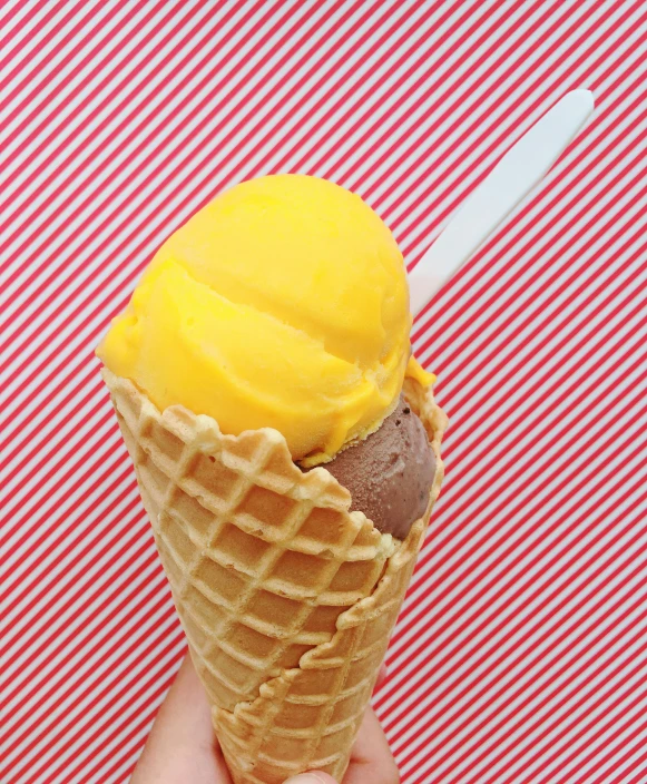 an ice cream cone with orange topping in it