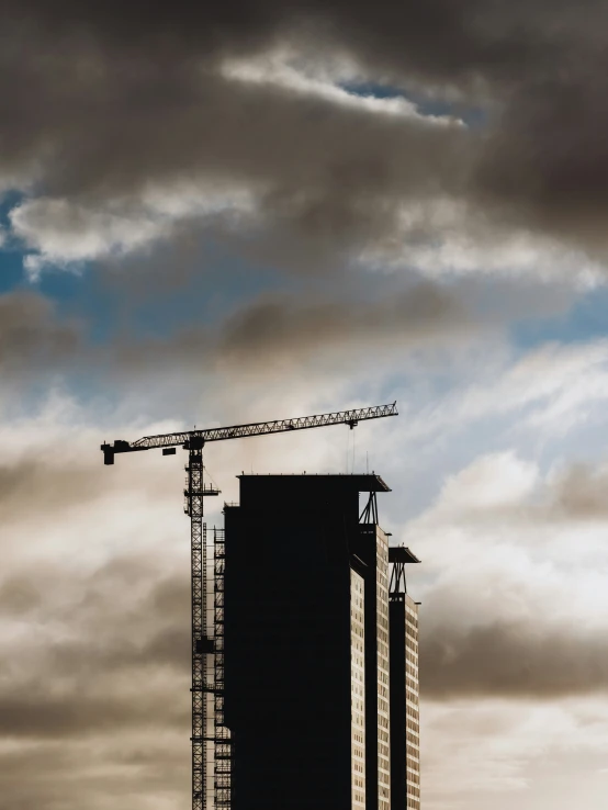 a crane atop a building under construction